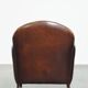 A vintage-style armchair with character, upholstered in beautifully patinated sheepskin.