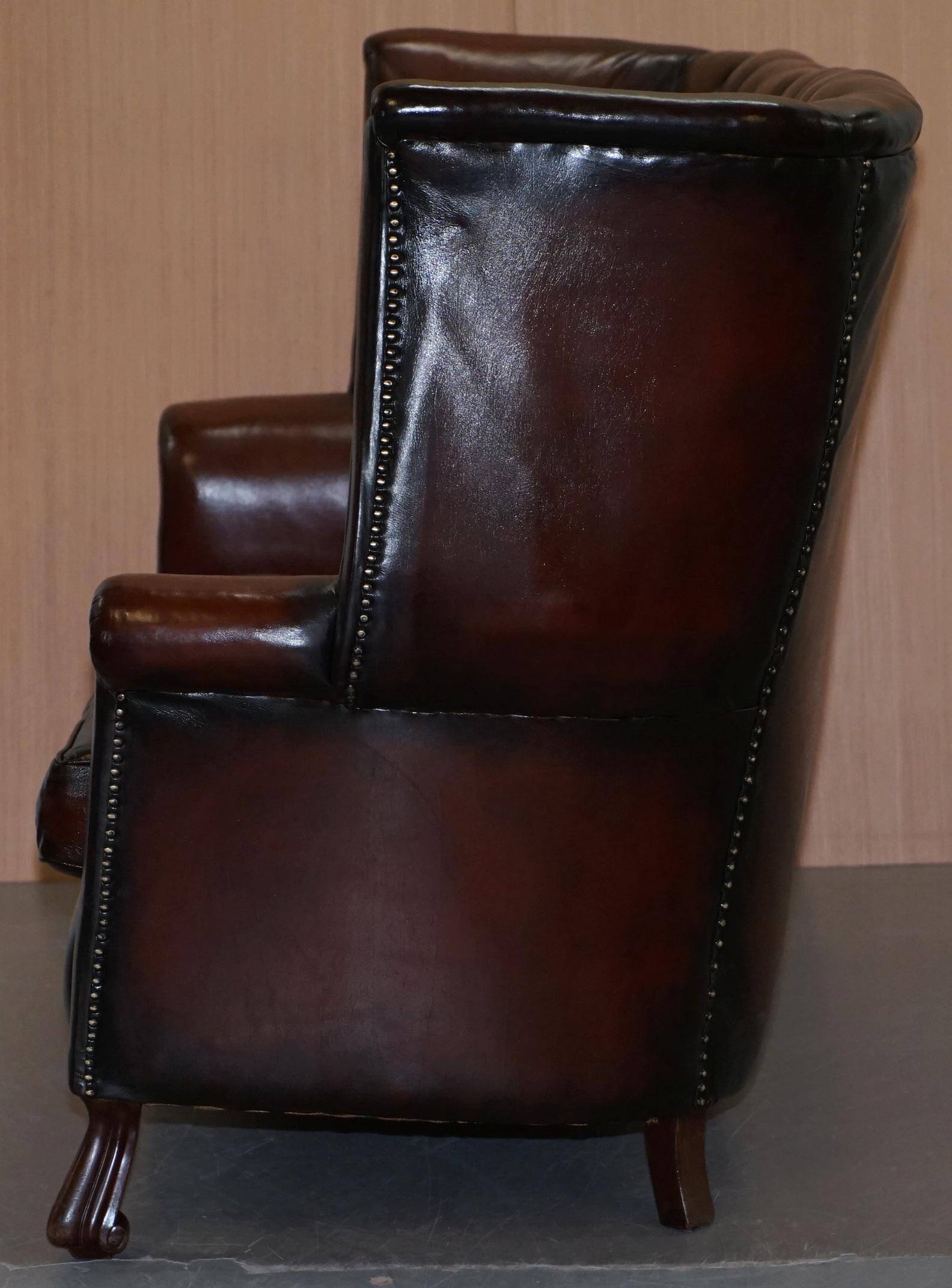 Victorian leather canapé and armchair, barrel back, circa 1860, restored.