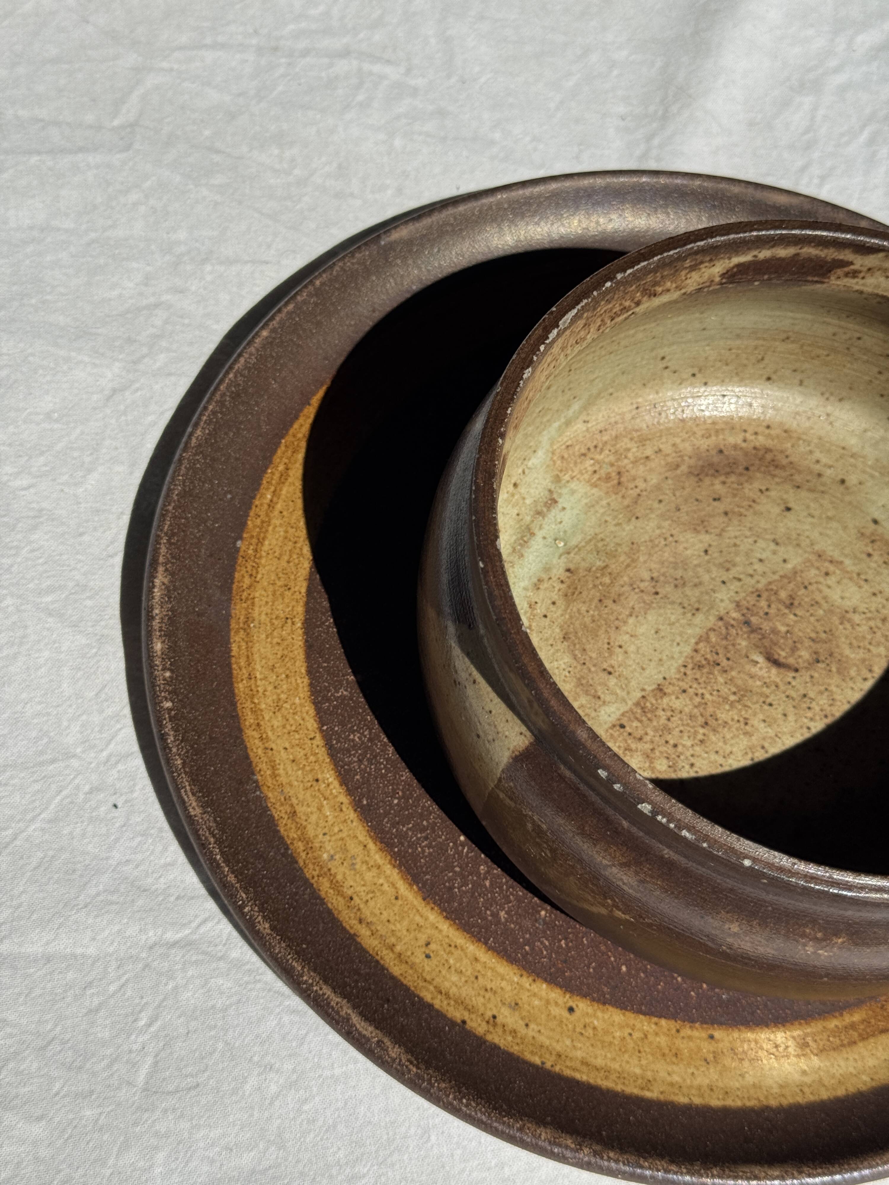 A small stoneware bowl, brown exterior, speckled grey interior D15