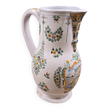 Moustiers faience pitcher signed with hand-painted mythological decoration.