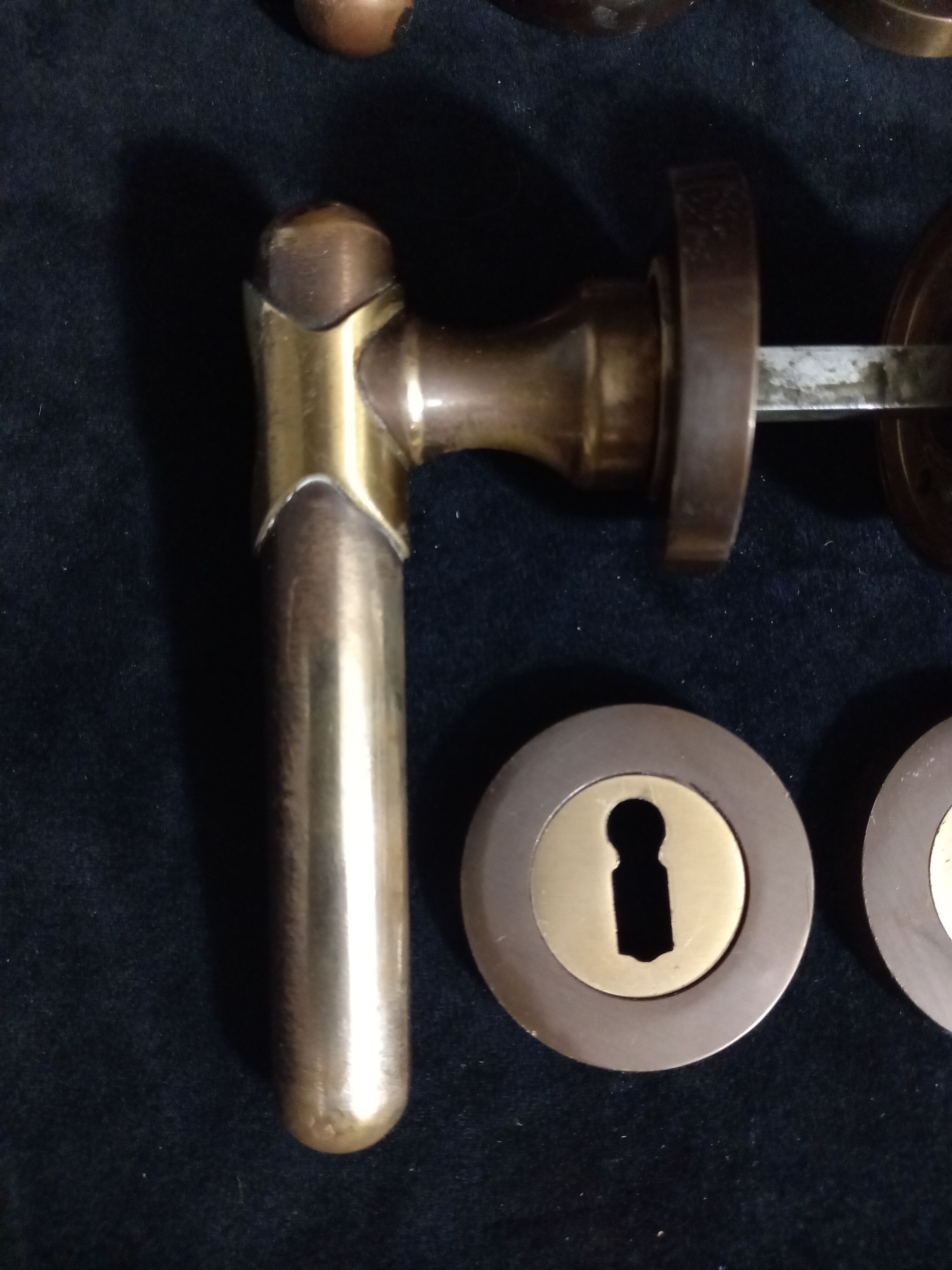 Four pairs of brass door handles with key plates