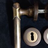 Four pairs of brass door handles with key plates