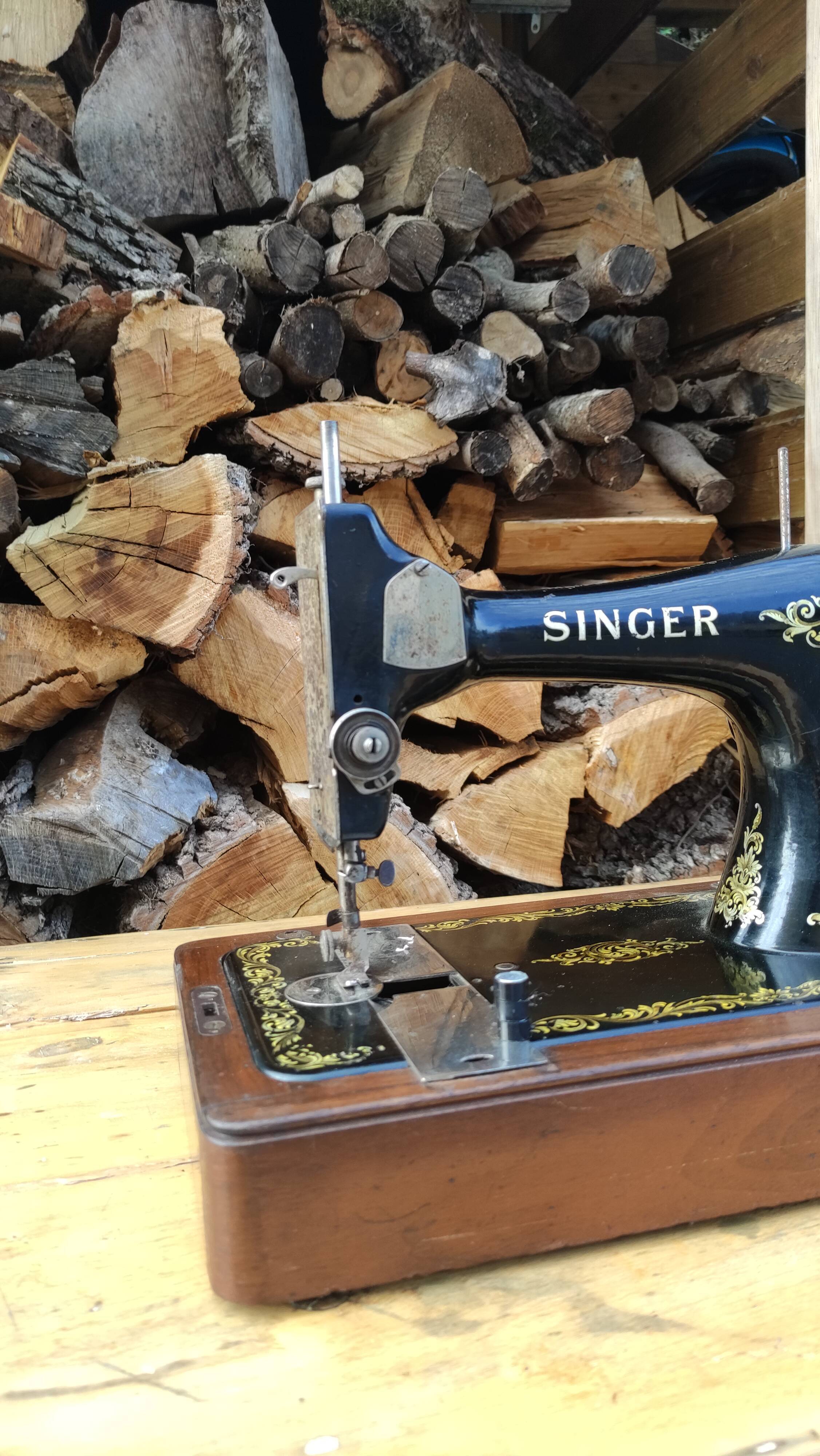 Old Singer sewing machine on its original base