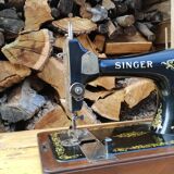 Old Singer sewing machine on its original base