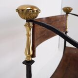 Curule armchair in wrought iron and leather