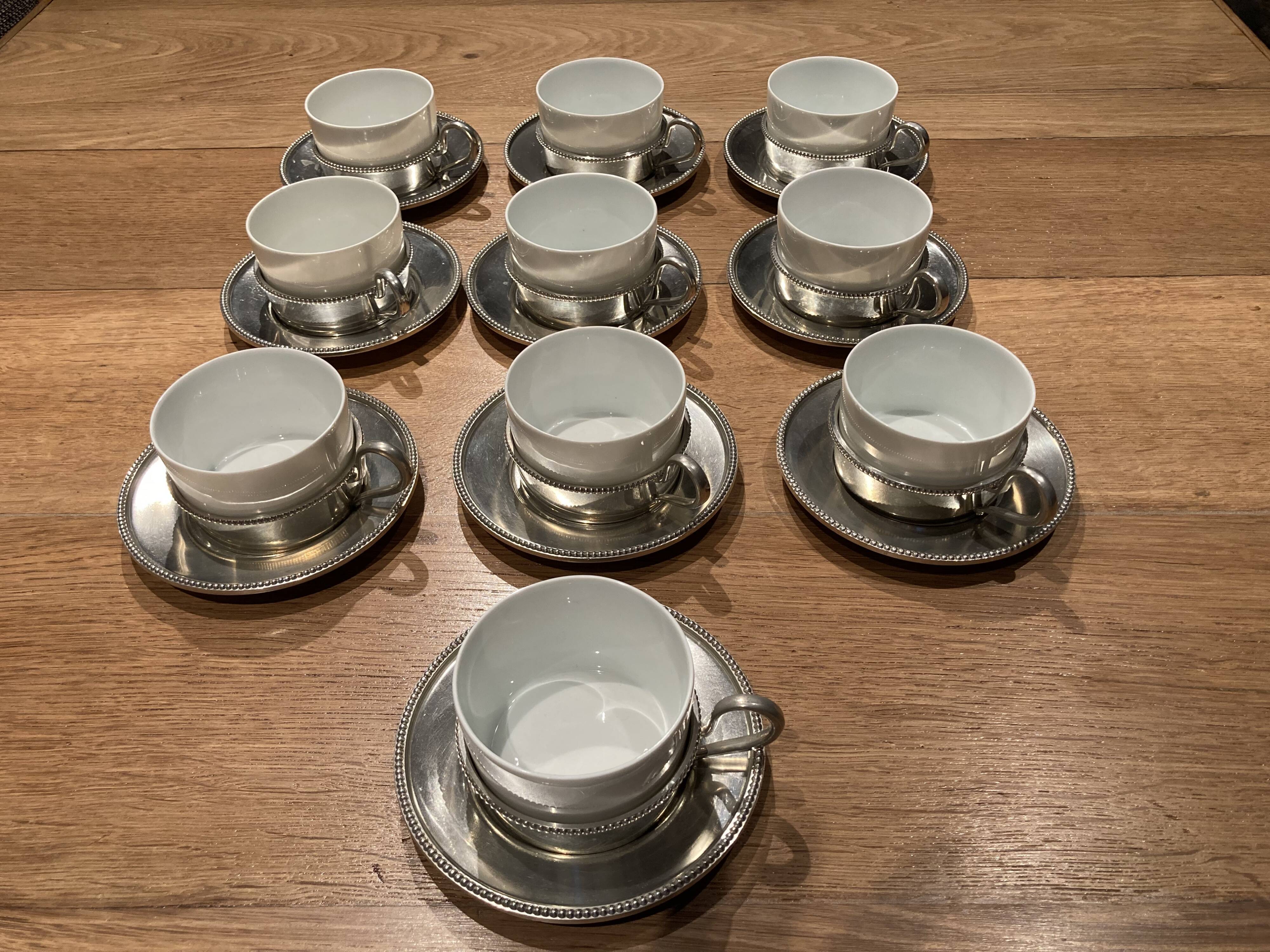 10 cups limoges and under cups in brushed tin