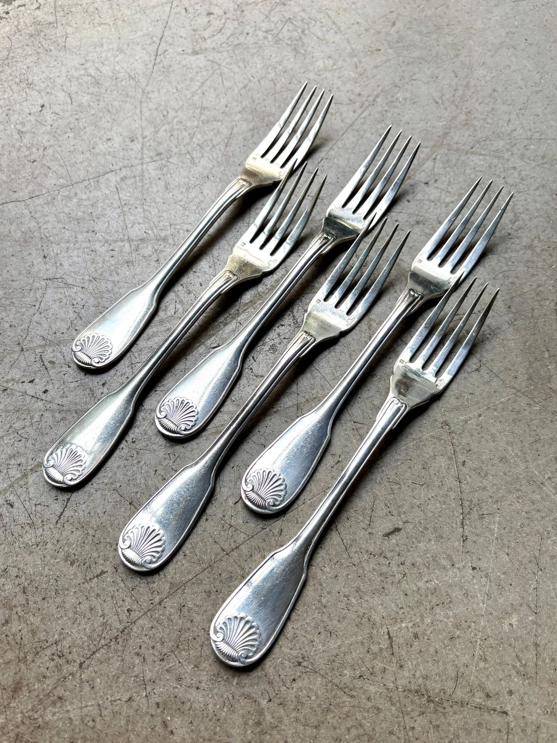 6 Christofle fish forks in silver-plated metal, shell design.