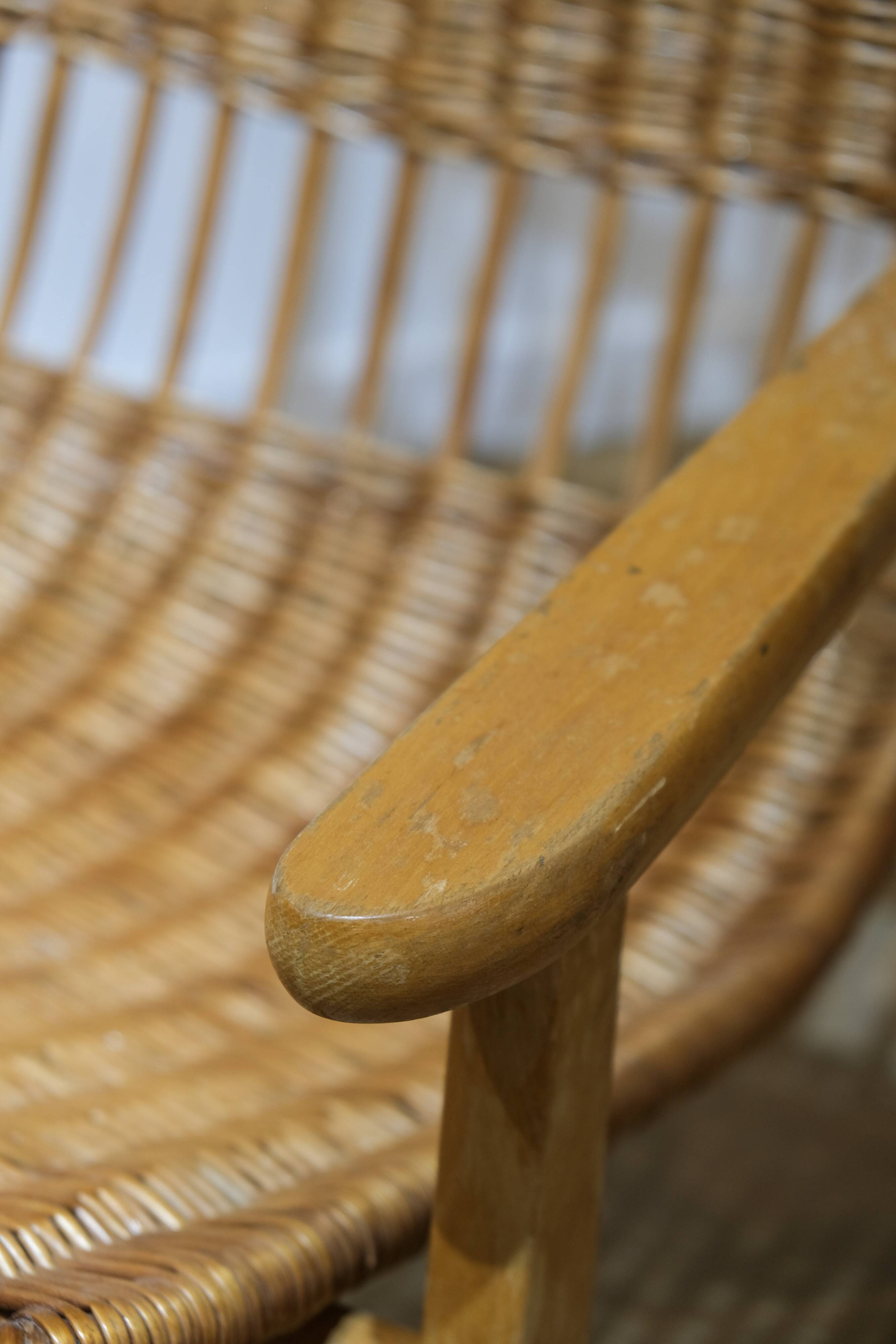 Wicker and wood rocking chair