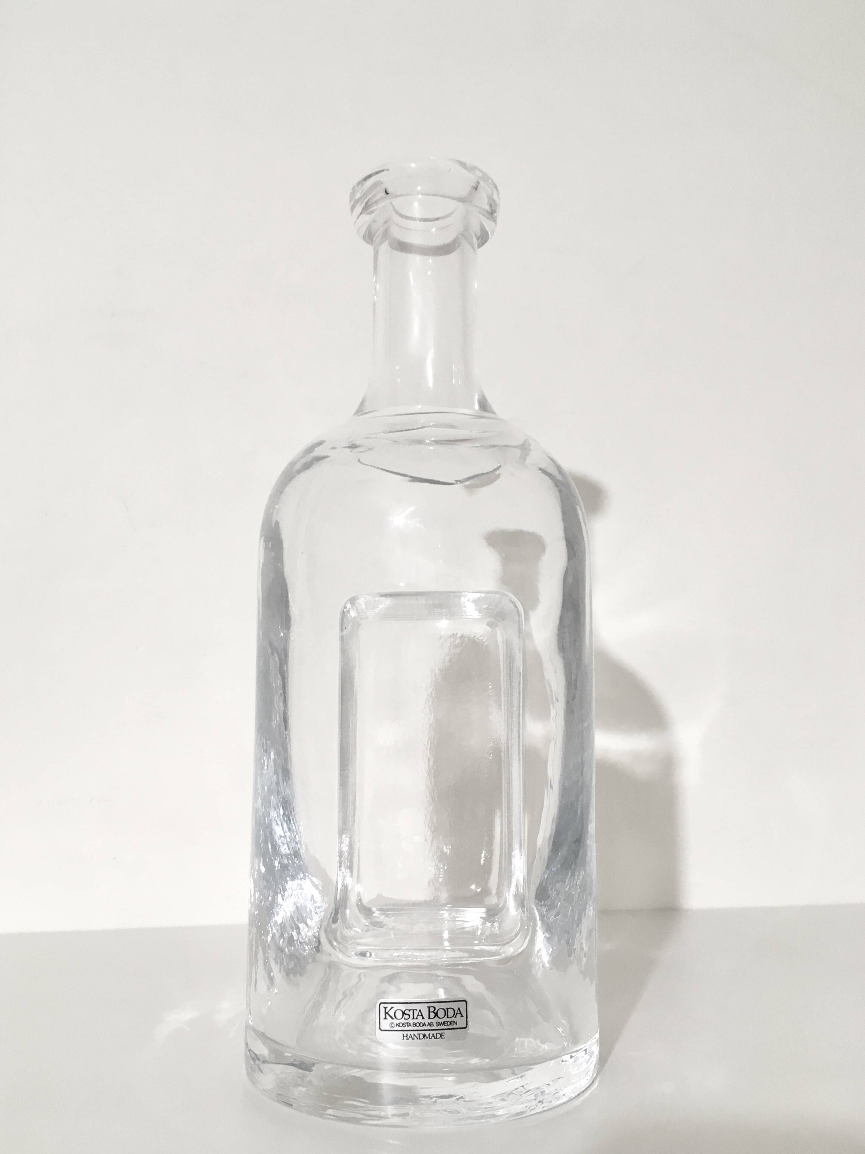 Kosta Boda carafe in blown glass 26 cm with sculptural imprint • Sweden