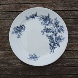 Ancien plat en terre de fer décor floral bleu