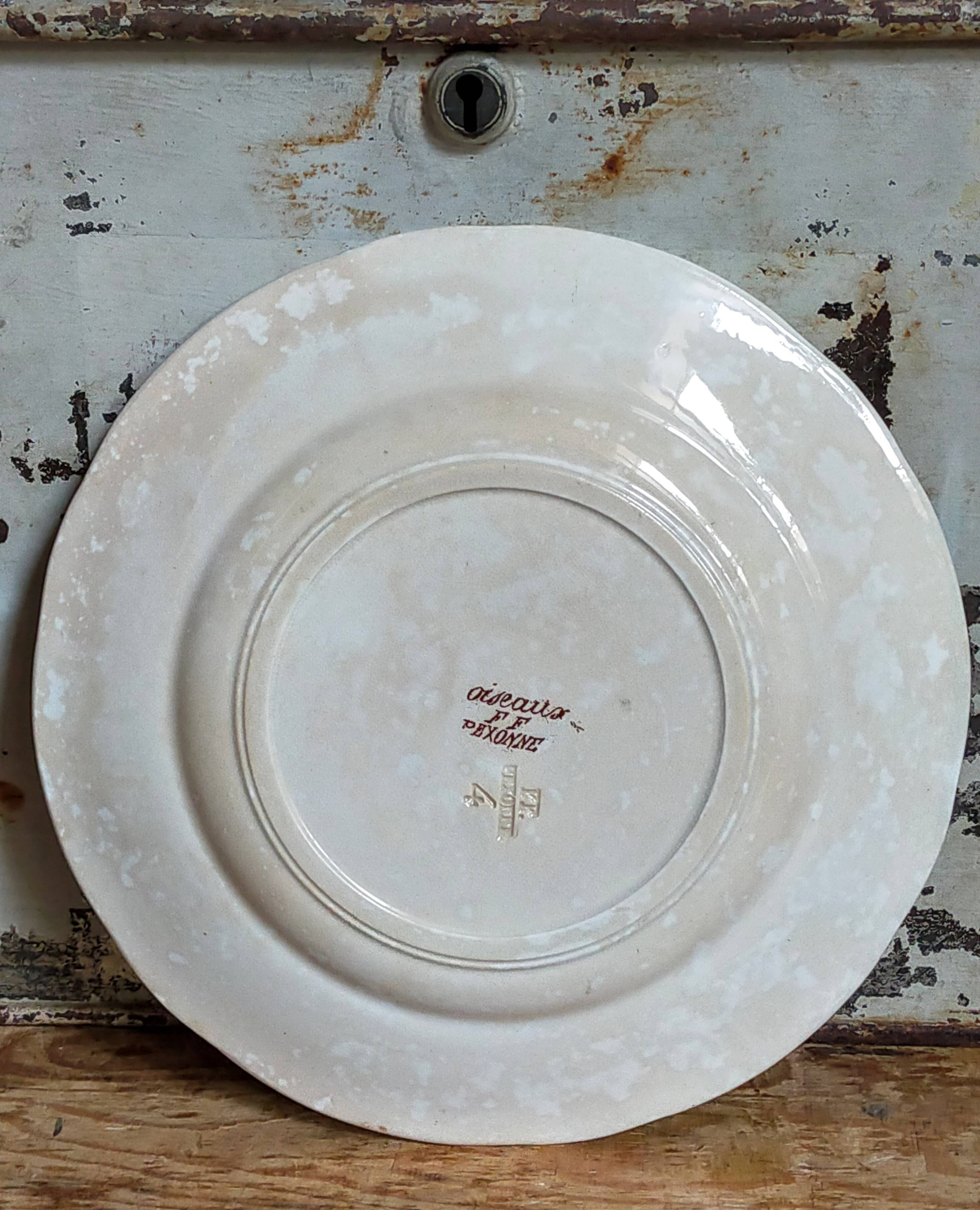 Seven iron earth dessert plates with birds ffPexonne late 19th century