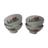 4 old bowls in faience decorate the dairy and her cow