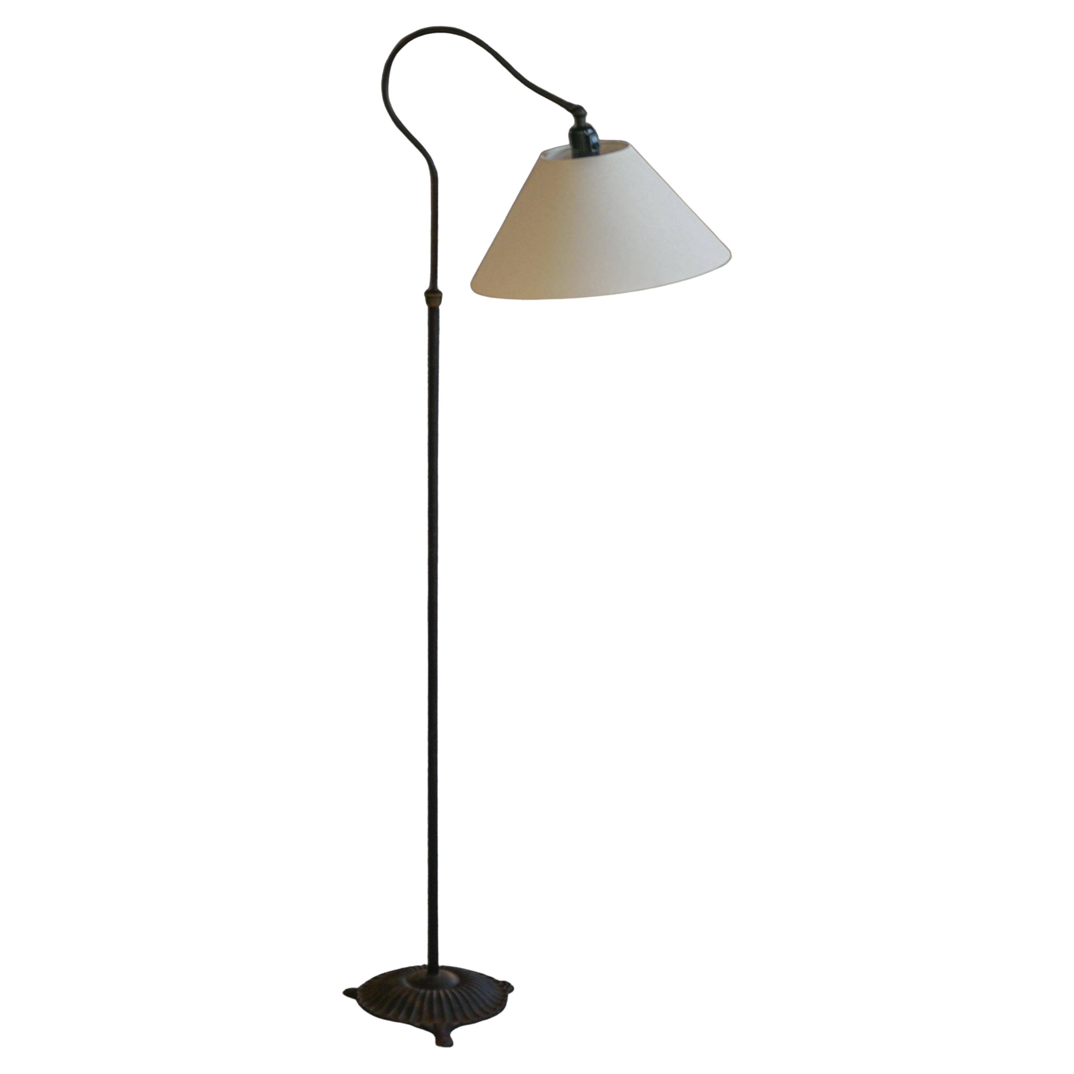 Danish wrought iron floor lamp from the mid-20th century with a curved arm, 1950s.
