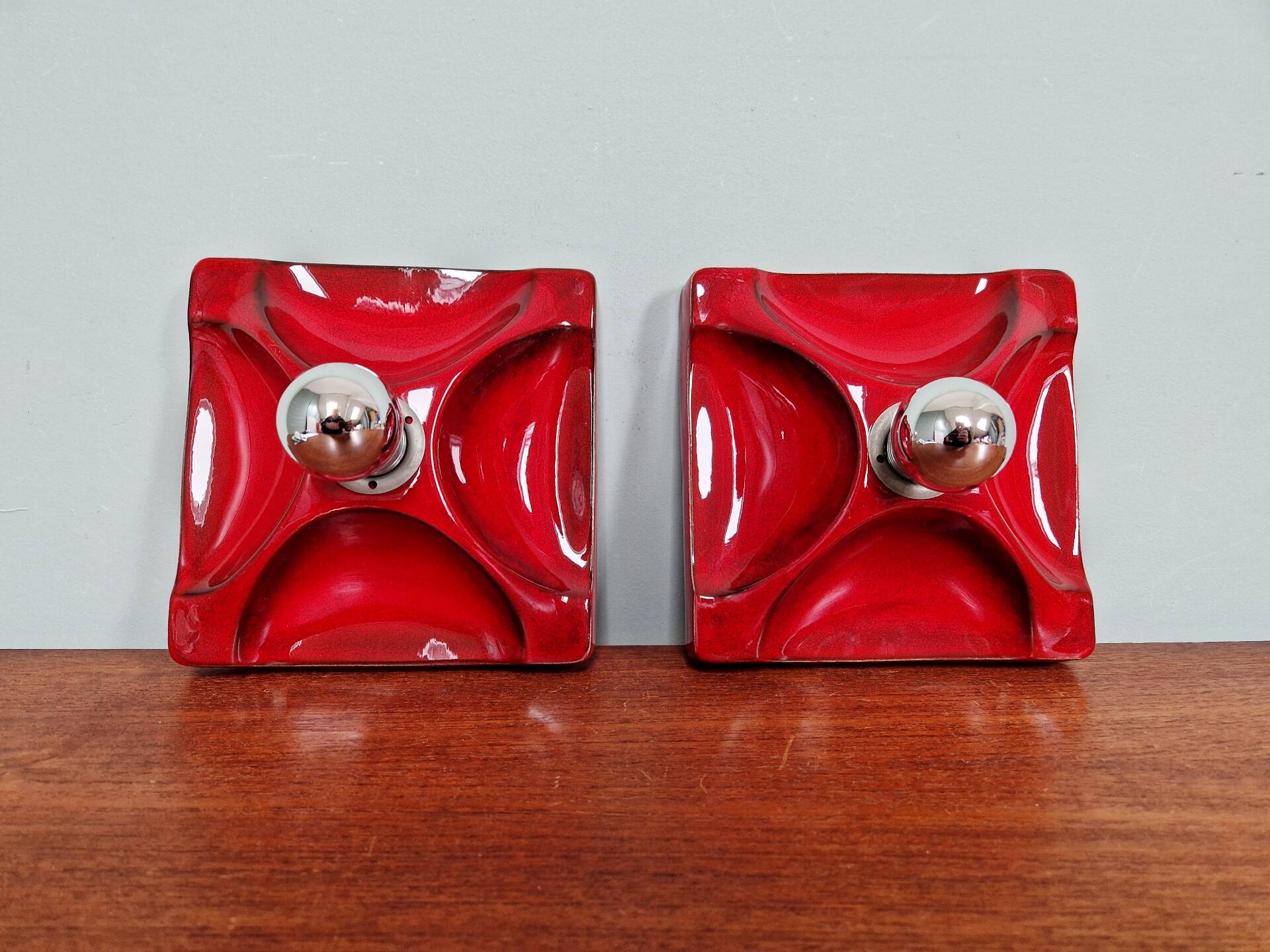 Pair of Space Age wall sconces in red ceramic, 1970.
