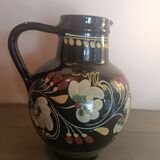 Large glazed terracotta pitcher with floral decoration