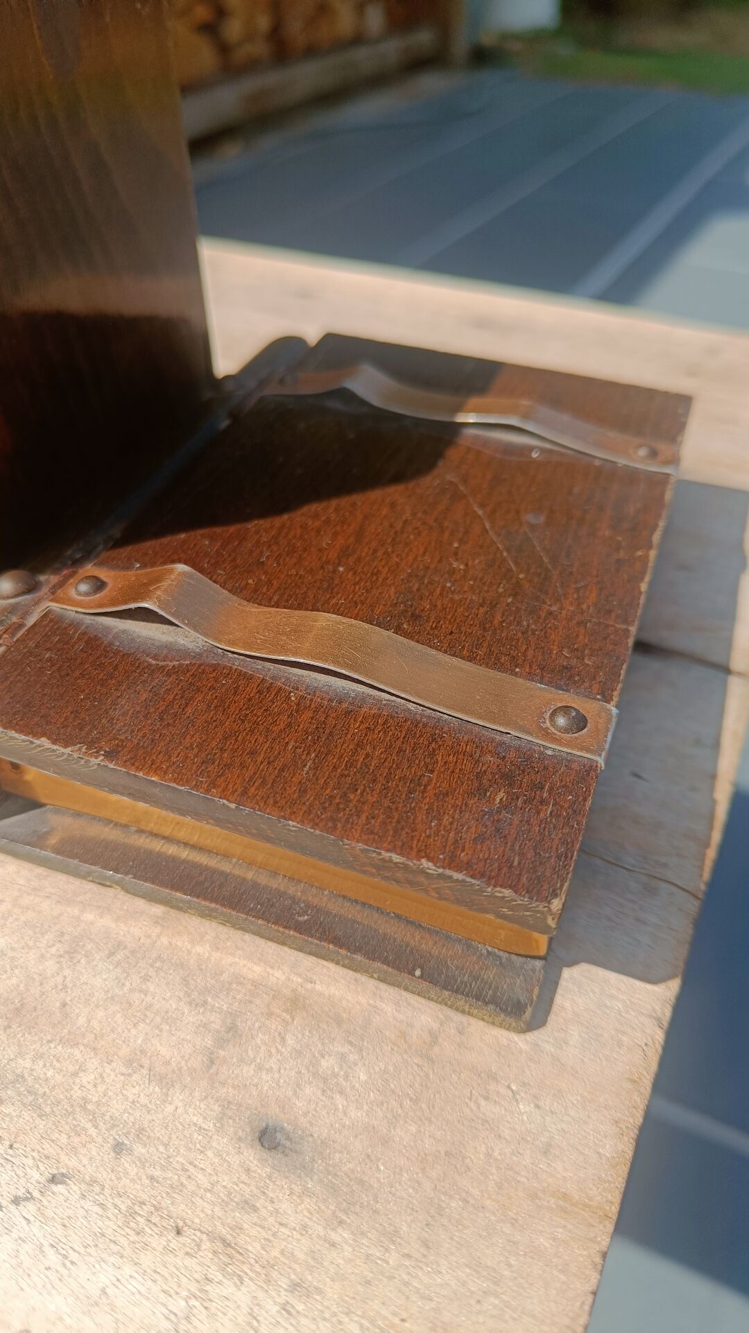Wooden trompe-l'œil bookends with a book and box