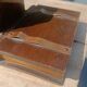 Wooden trompe-l'œil bookends with a book and box