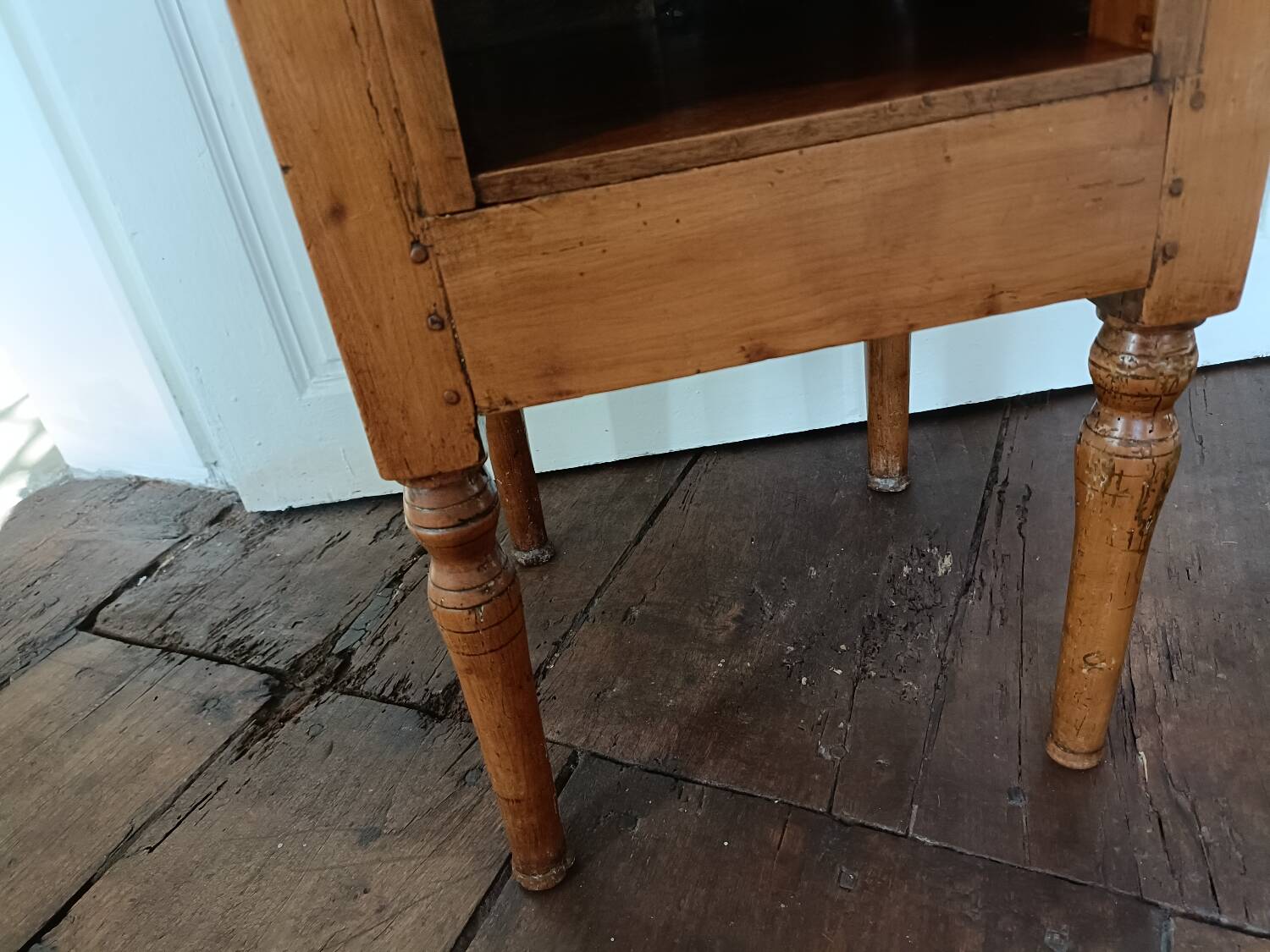 Open wooden bedside table