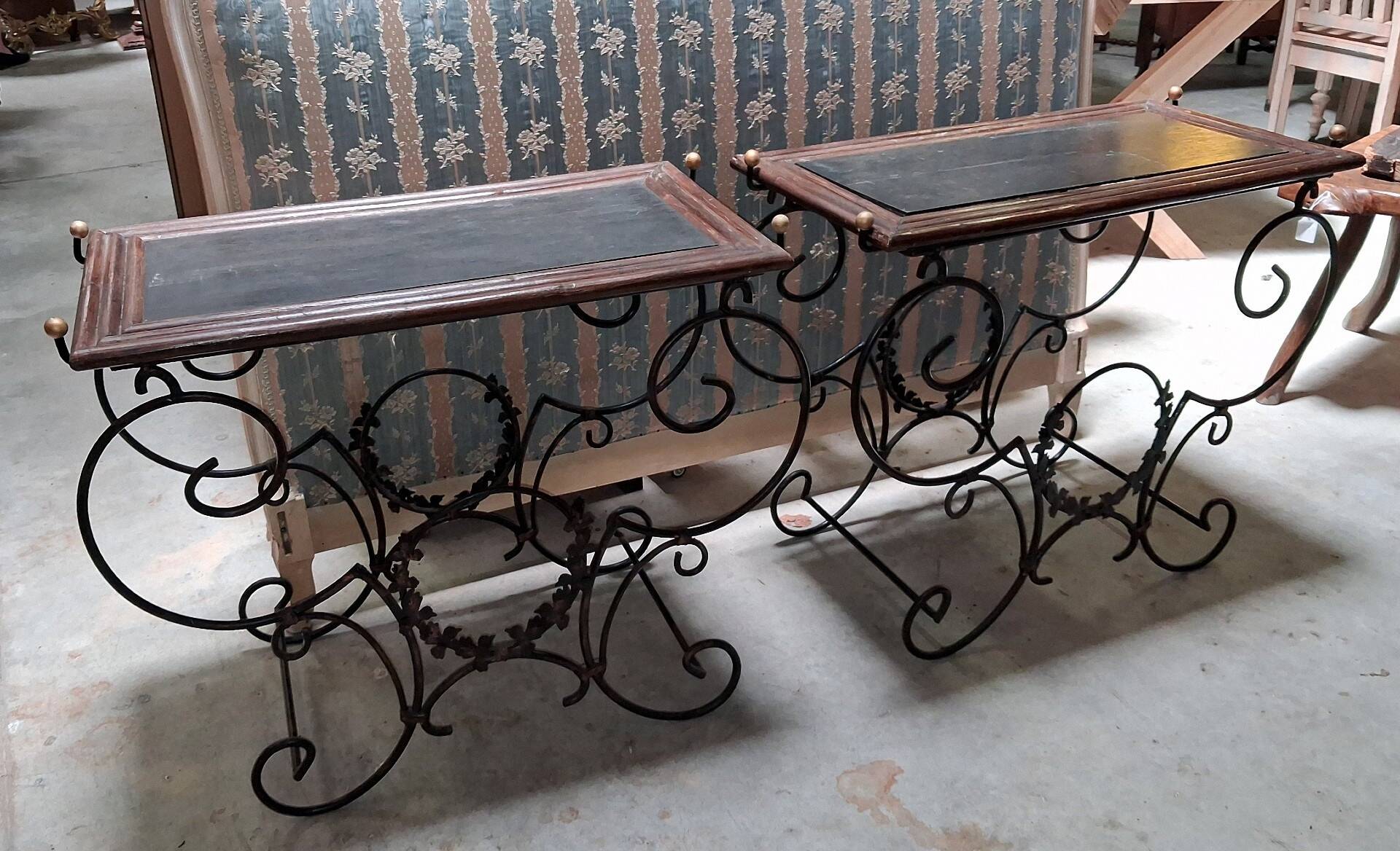 Pair of wrought iron and blackened wood consoles from the mid-20th century.