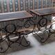 Pair of wrought iron and blackened wood consoles from the mid-20th century.