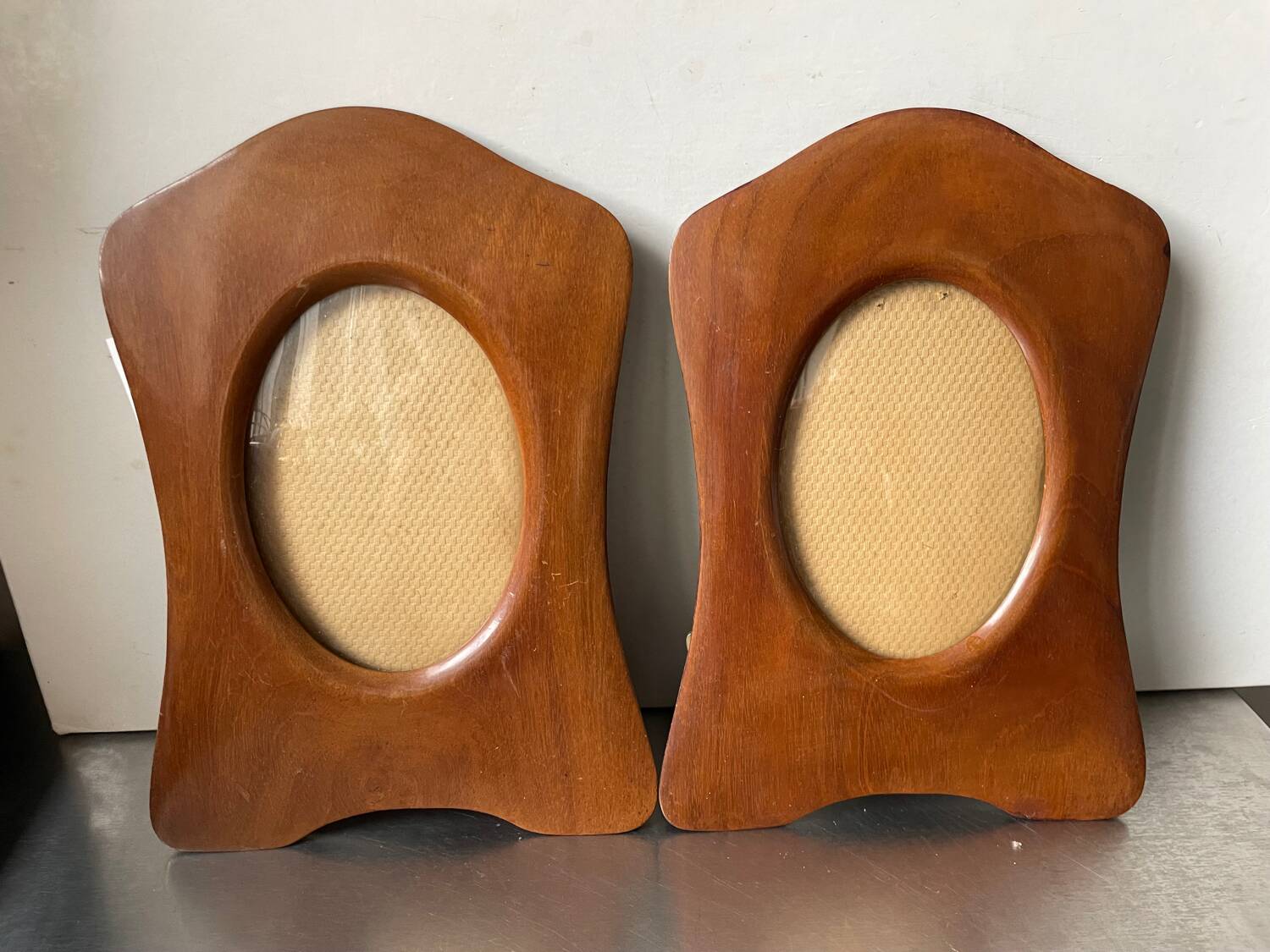 Pair of antique  identical art deco mahogany wooden frames measurements each  25 cm x 17.5 cm  convex glasses