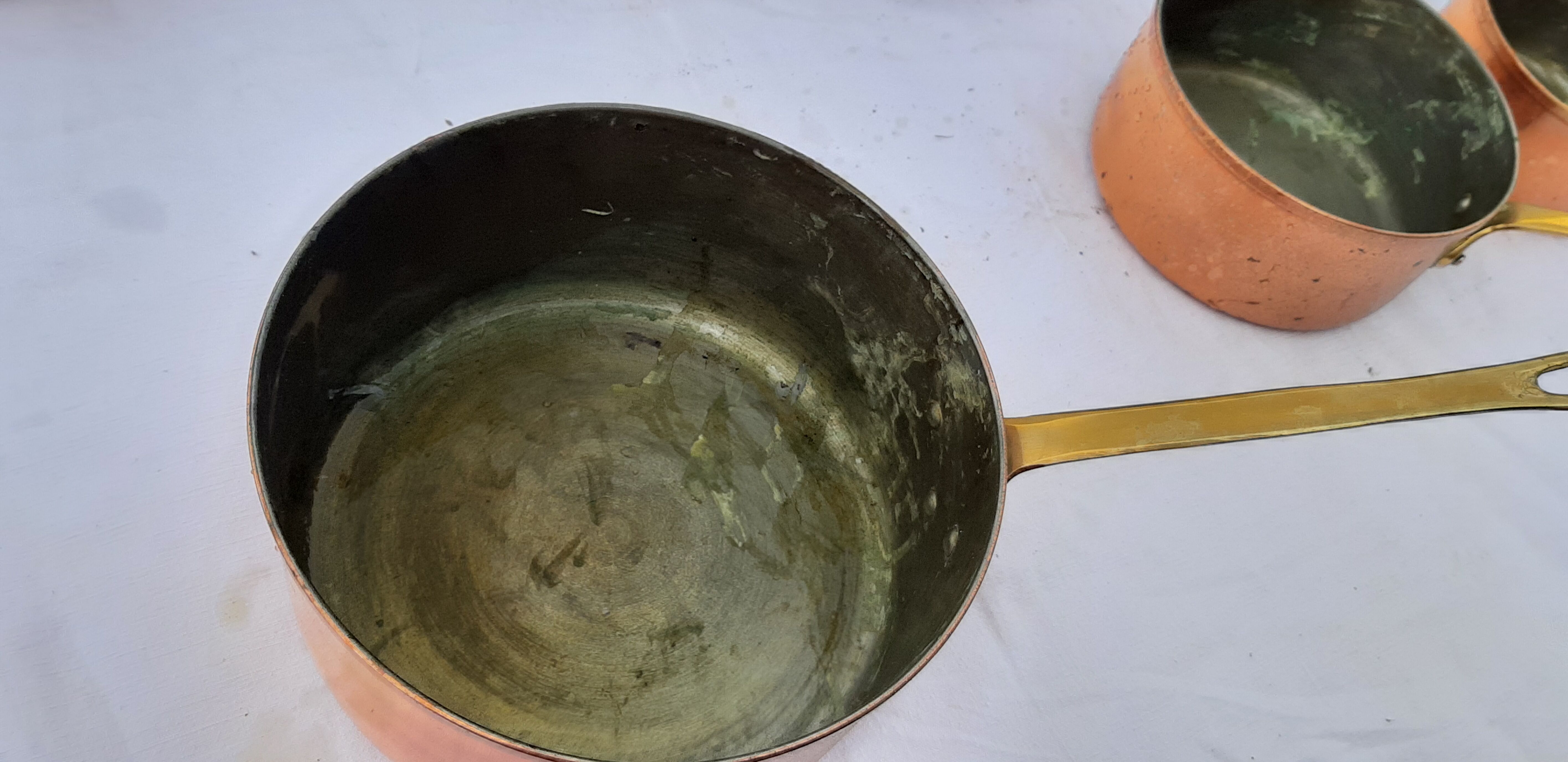 Lots of tinned copper kitchen utensils