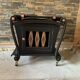 Renovated vintage bar cart in black and copper with removable serving tray.