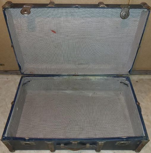 Old black wooden trunk with reinforcements