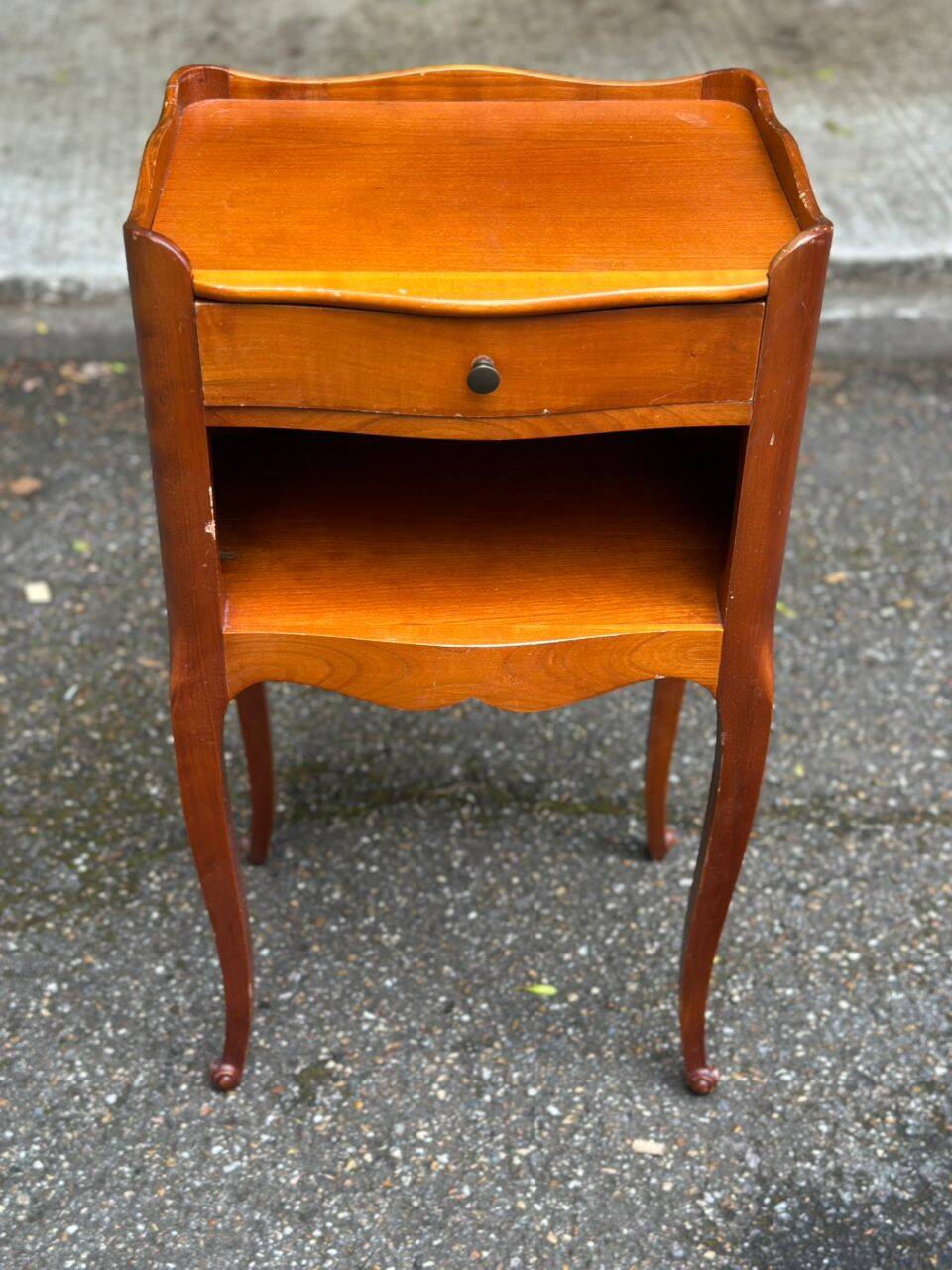 2 bedside tables in transitional or Louis XV style, made of curved solid wood with drawers.