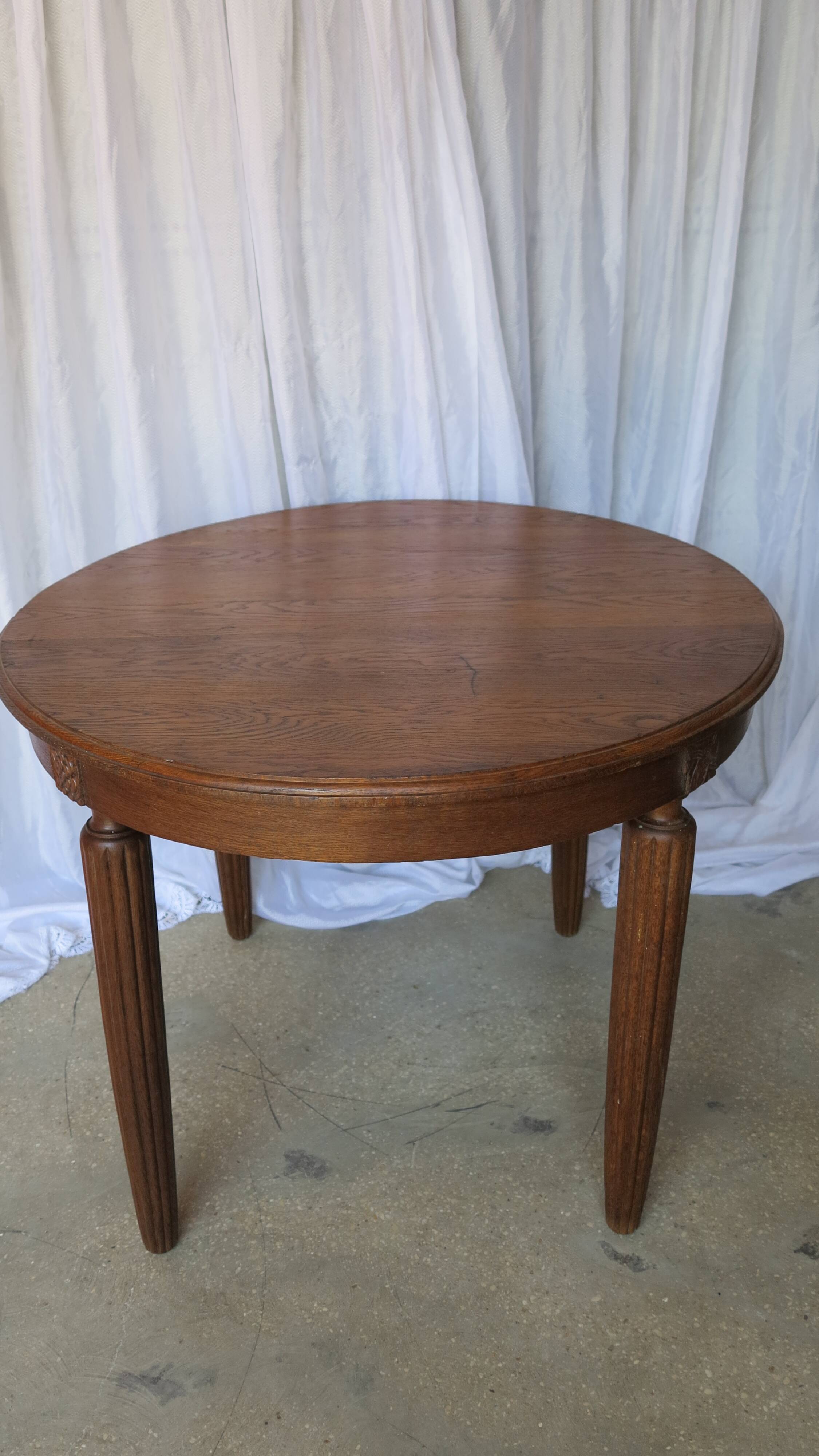 1930s oak dining table, slightly oval.