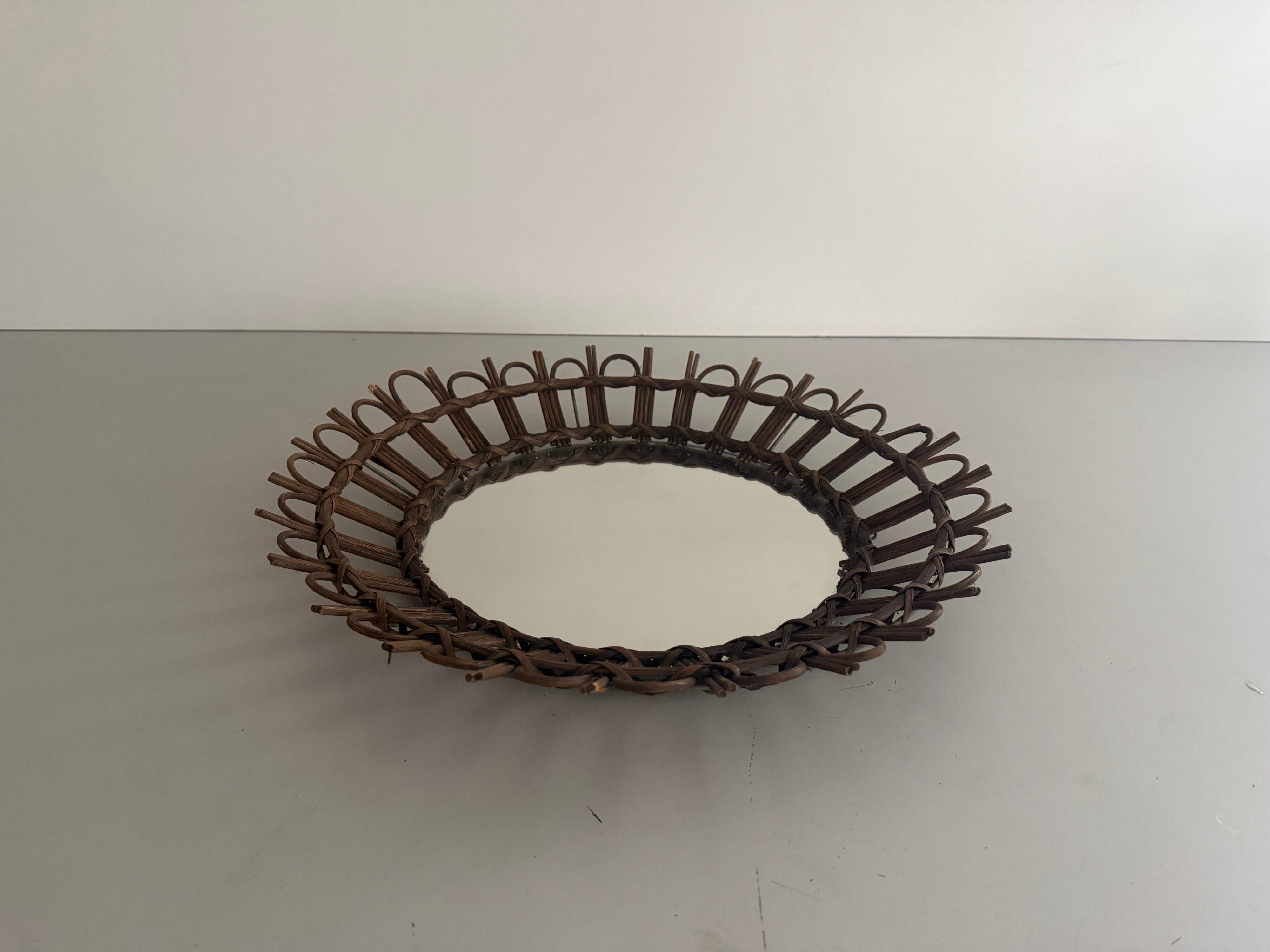 Round wall mirror with a modern mid-century wooden frame, 1960s, Germany.