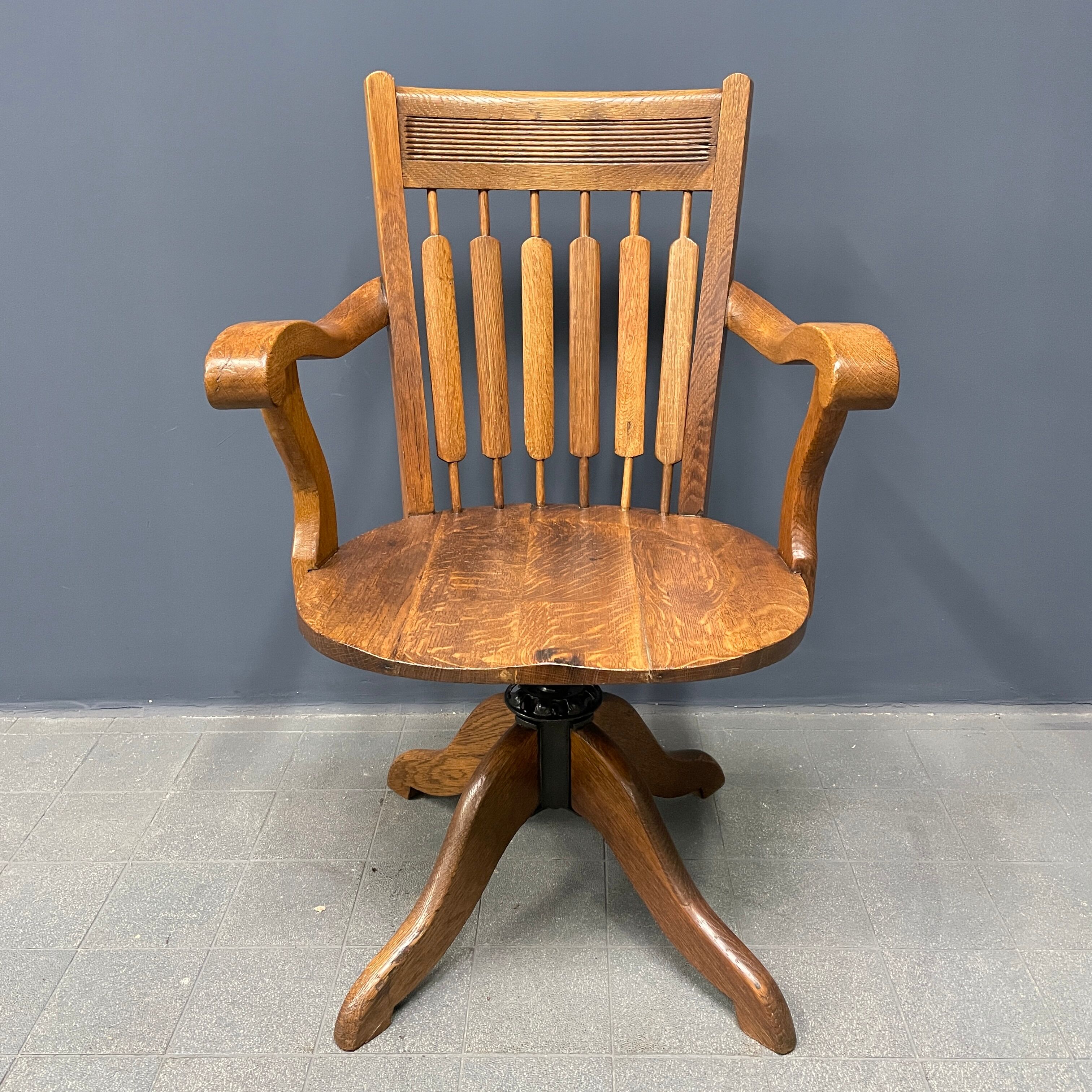 Antique American oak office chair with armrests 1920s