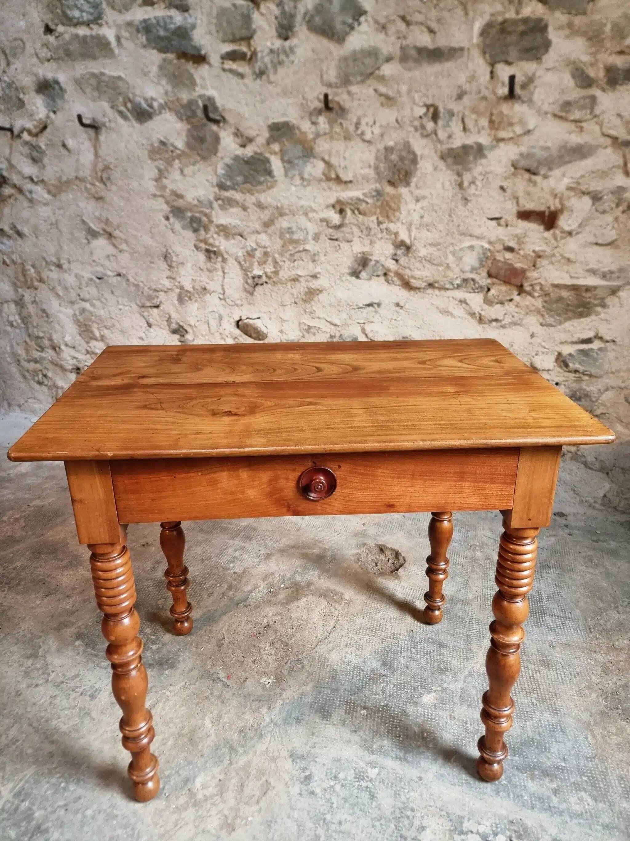 Small antique French writing table in walnut with a drawer, around 1900.