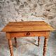 Small antique French writing table in walnut with a drawer, around 1900.