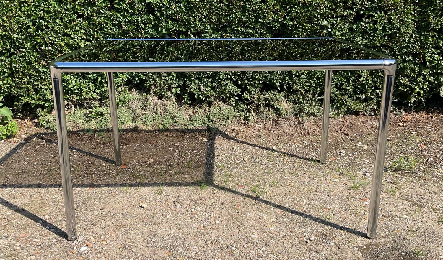 70s dining table in tubular chrome metal and smoked glass