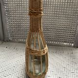 Wicker-sheathed glass bottle