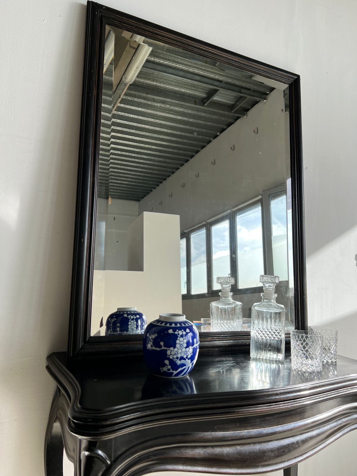 Rectangular mirror in molded blackened wood, beveled glass