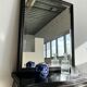 Rectangular mirror in molded blackened wood, beveled glass