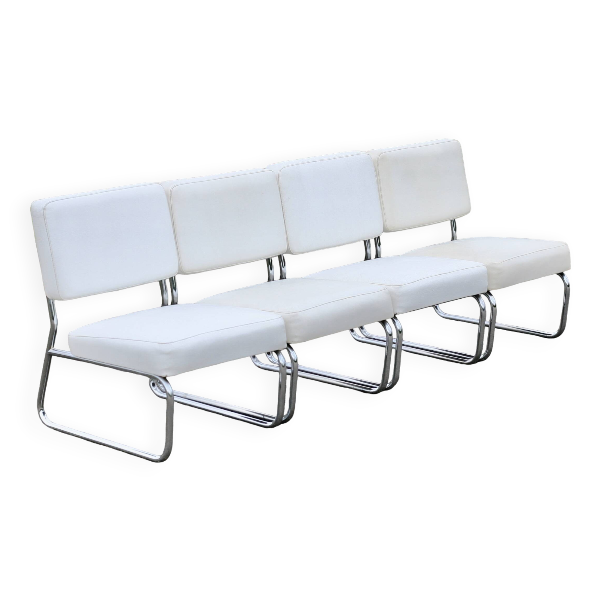 4 armchairs forming a modular sofa. Steel, imitation leather, 70s