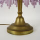 Table lamp, bedside lamp, speckled pink globe and glass and wood beads. Year 60