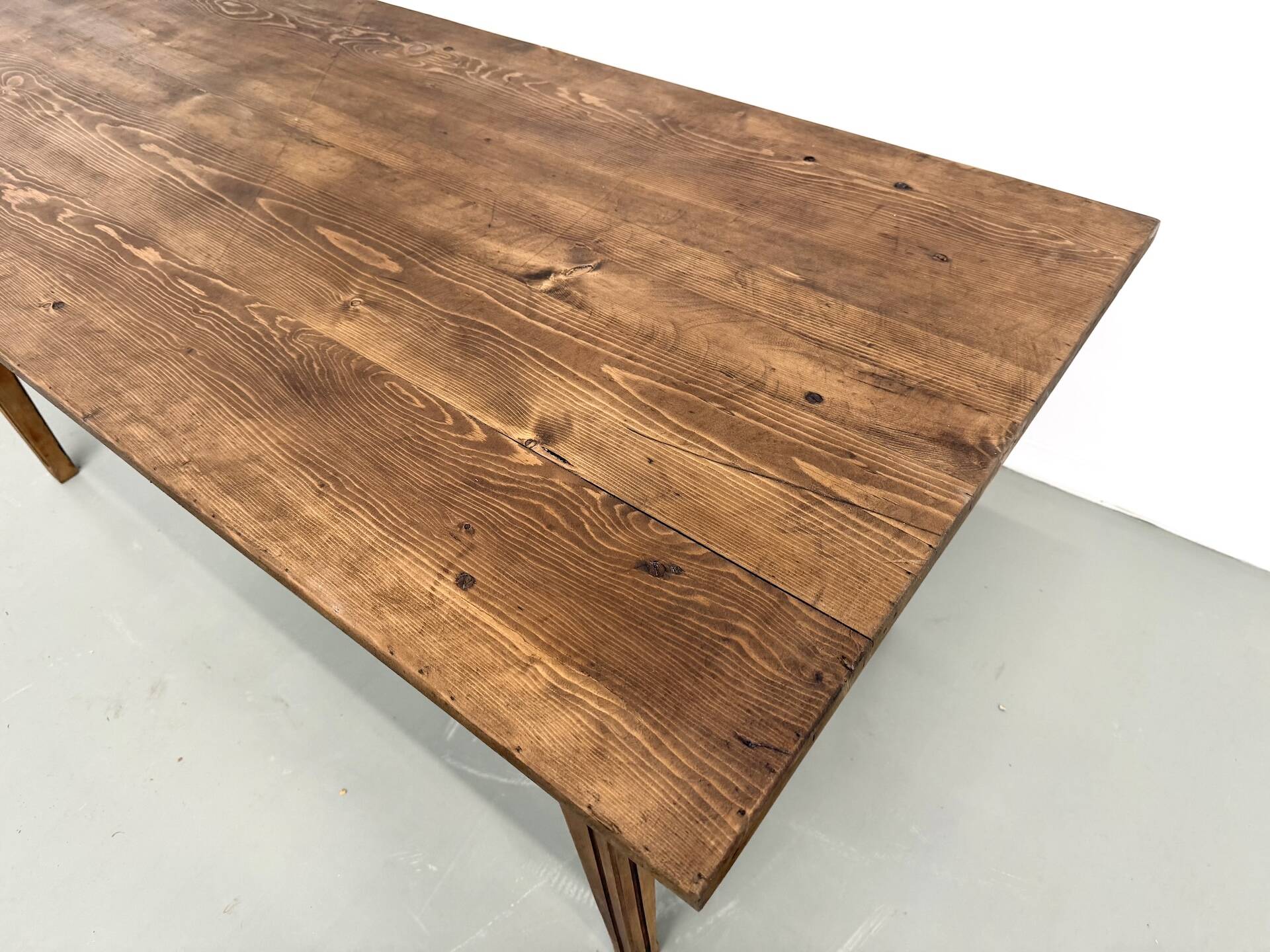Solid pine farmhouse table, two drawers, fluted legs, France.