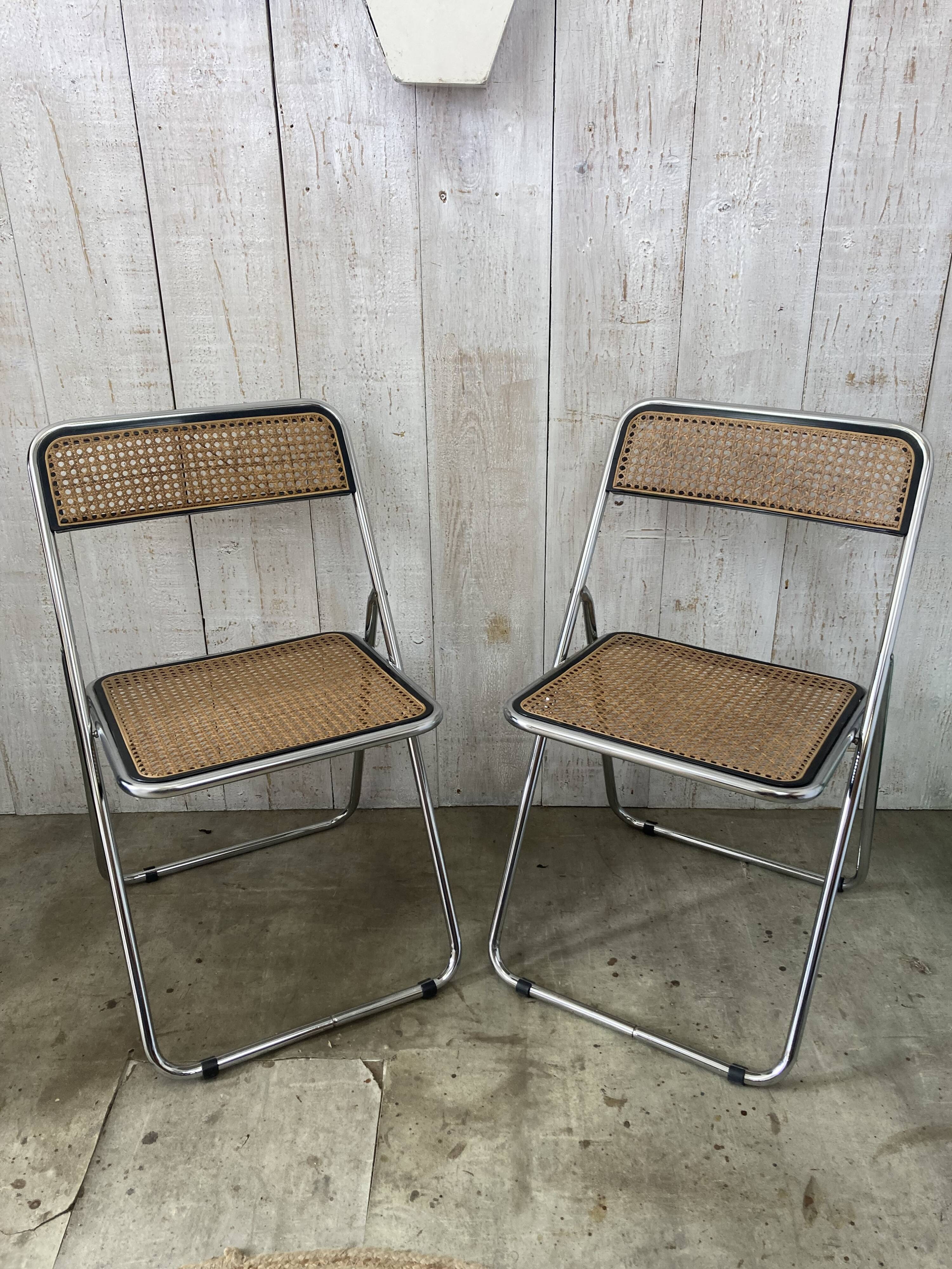 Pair of chrome and cane folding chairs