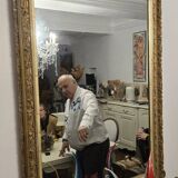 Large antique mirror from the Napoléon III era, finely carved and gilded with gold leaf.