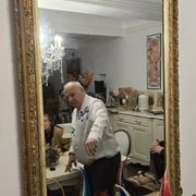 Large antique mirror from the Napoléon III era, finely carved and gilded with gold leaf.