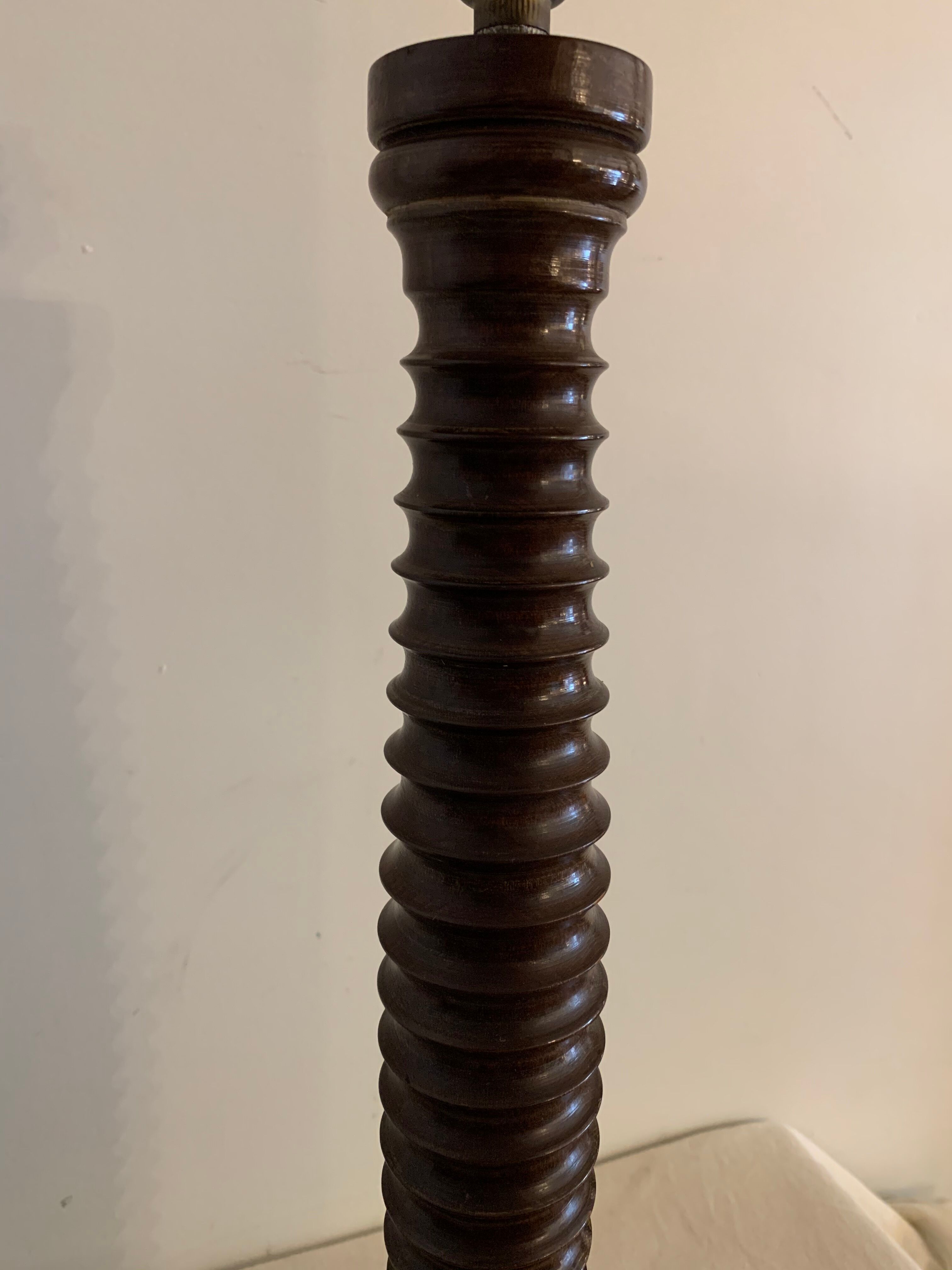 Turned wooden lamp foot in the shape of a warhead