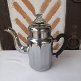 Silver metal coffee maker with glass cap