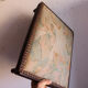 Small antique wooden and fabric footrest.