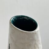 Ceramic flower pitcher.