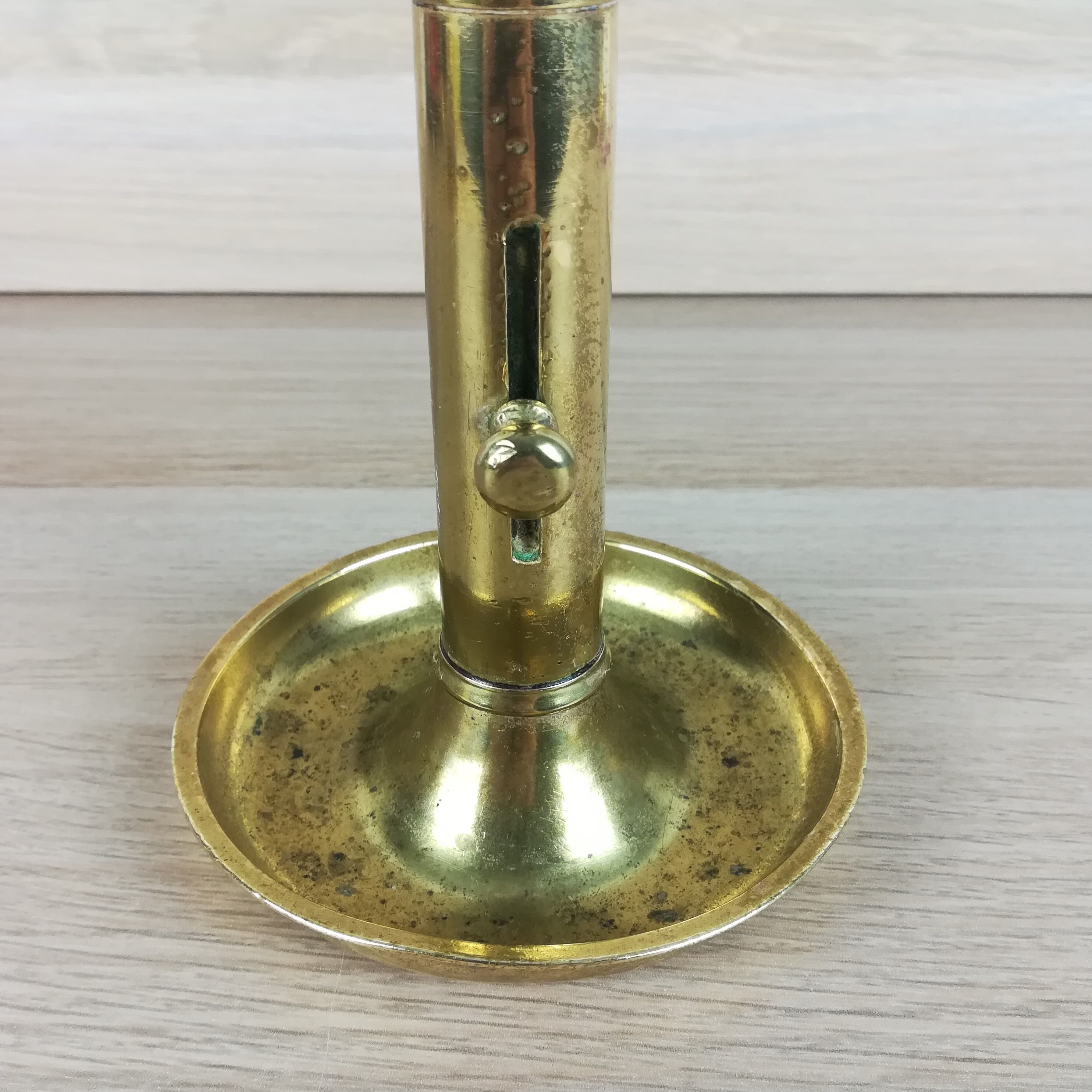 Brass pusher candle holder