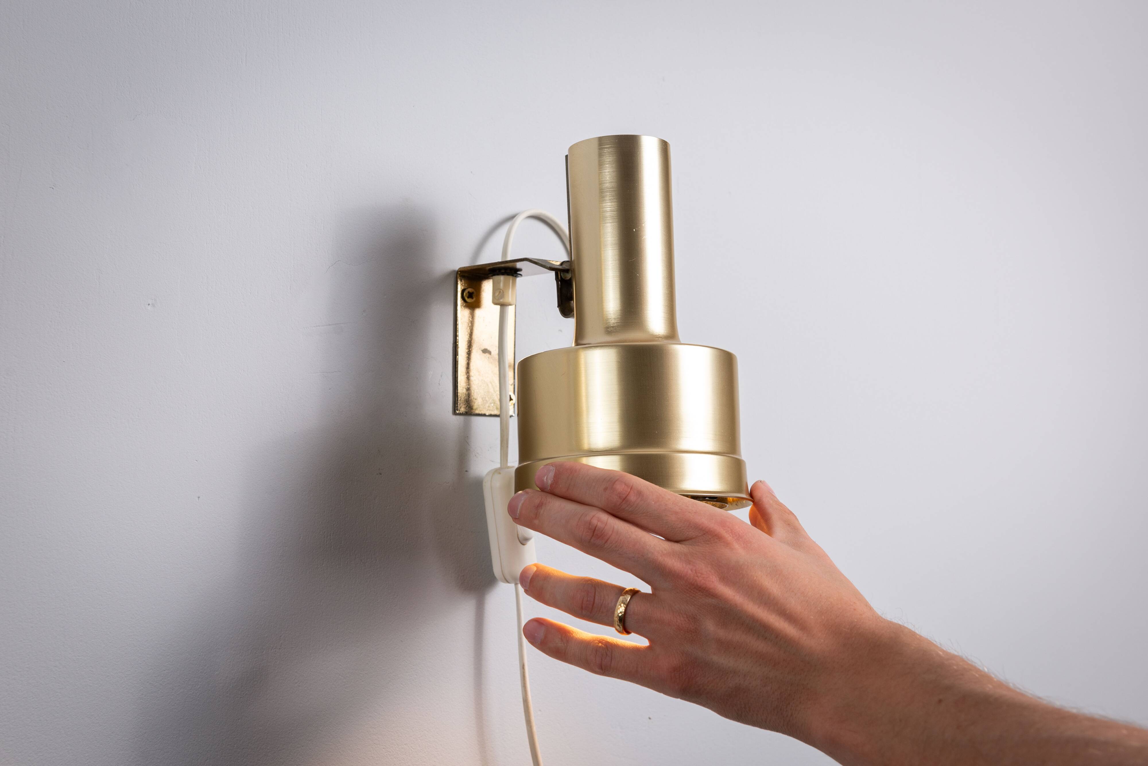 Pair of adjustable wall lamps designed by Per Sundstedt for Kosta Lampan